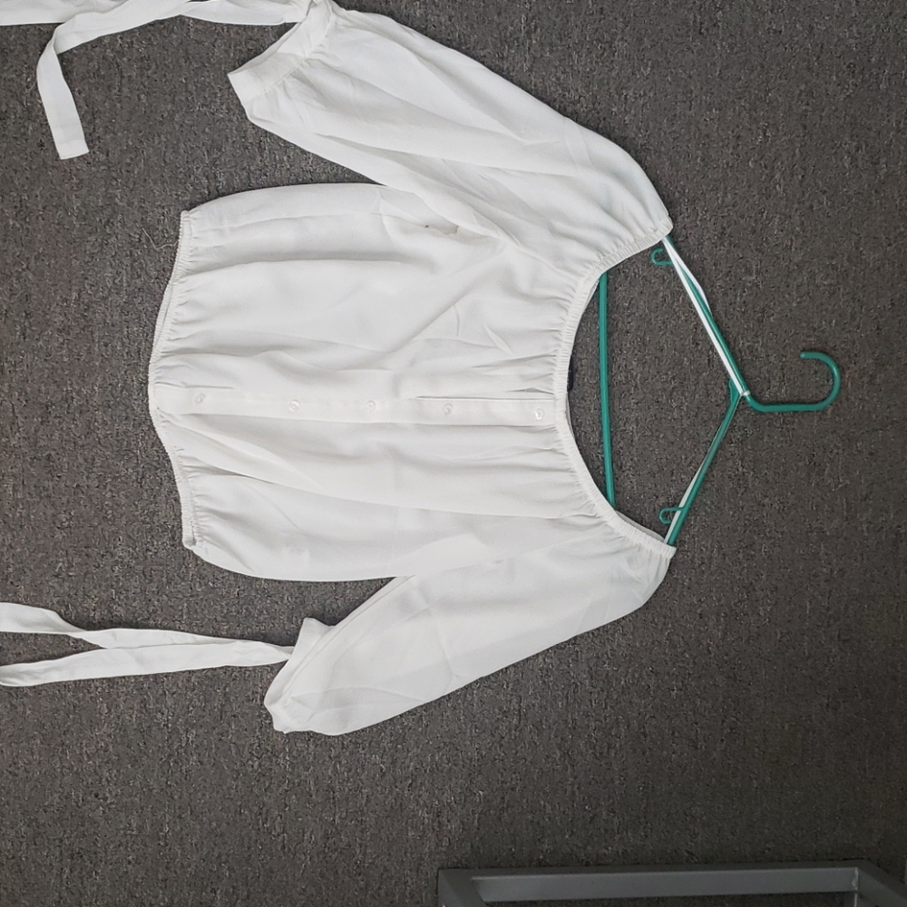 Ambiance shear shirt with ties on the arm.